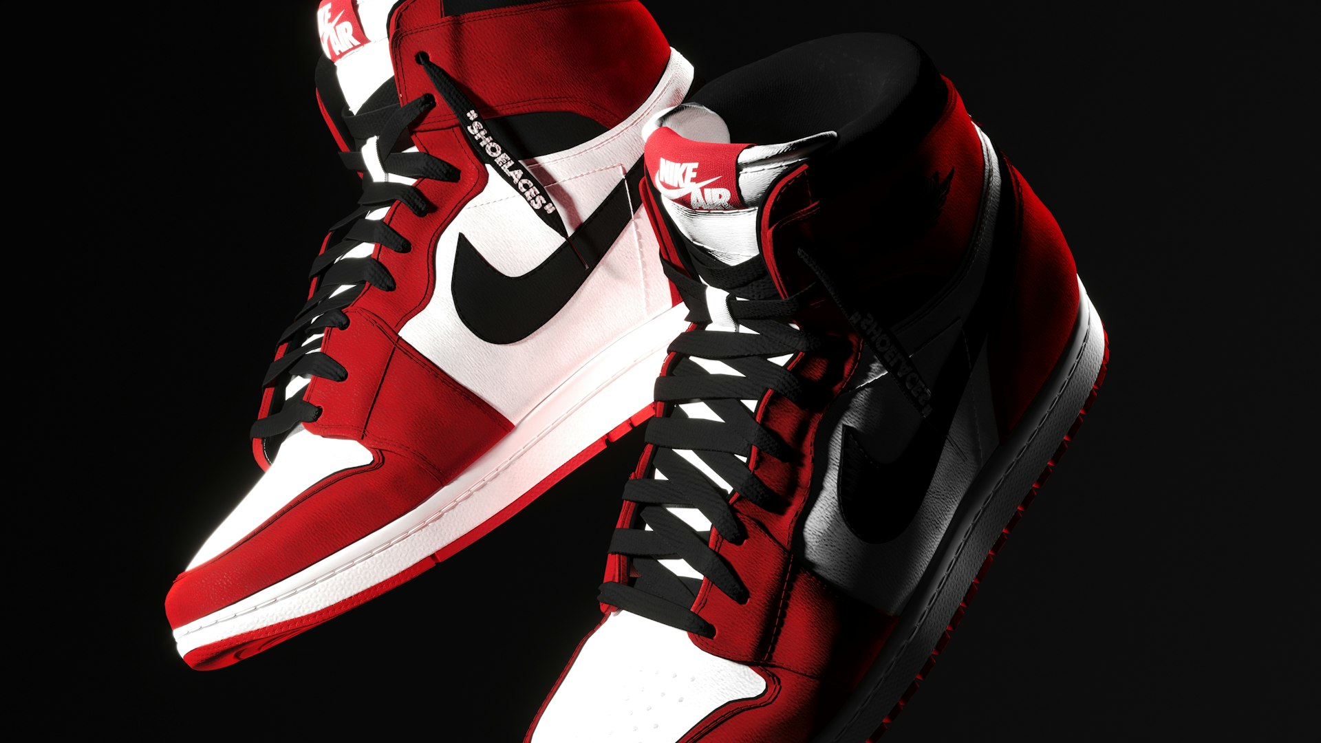A pair of red and white sneakers on a black background